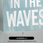 a sign that says in the waves on it