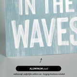 a sign that says in the waves on it