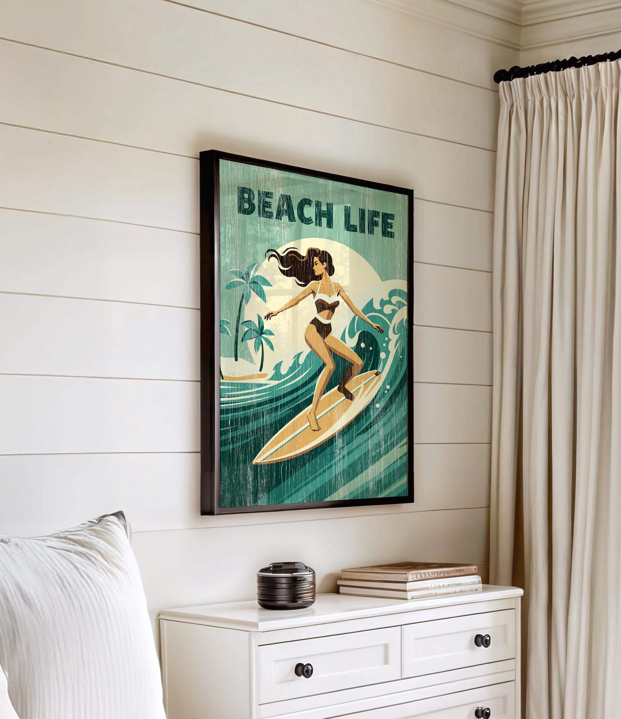 a framed vintage green poster of a woman surfing on a beach, with the text "BEACH LIFE" prominently displayed.