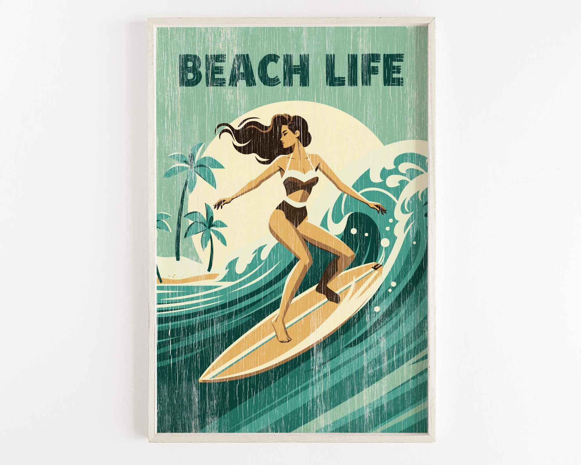 A framed poster depicting a woman surfing on a wave, with the text "BEACH LIFE" prominently displayed.