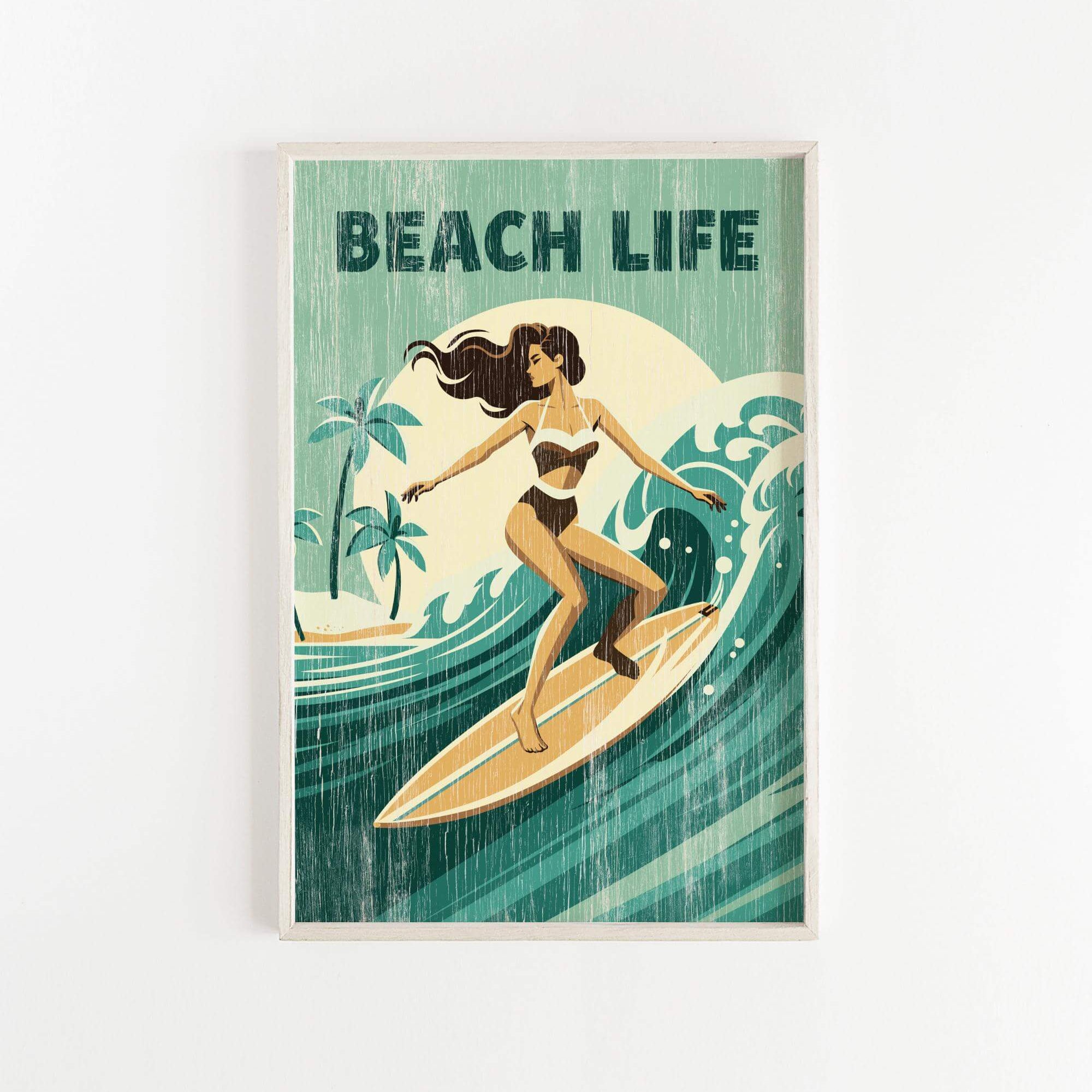 A framed poster depicting a woman surfing on a wave, with the text "BEACH LIFE" prominently displayed.