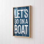 a wooden sign that says let&#39;s go on a boat