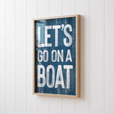 a wooden sign that says let&#39;s go on a boat