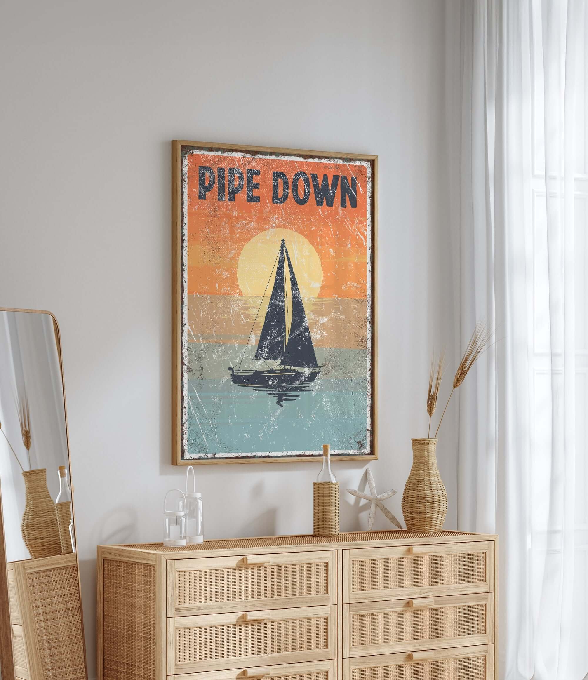 a picture of a sailboat on a wall above a dresser