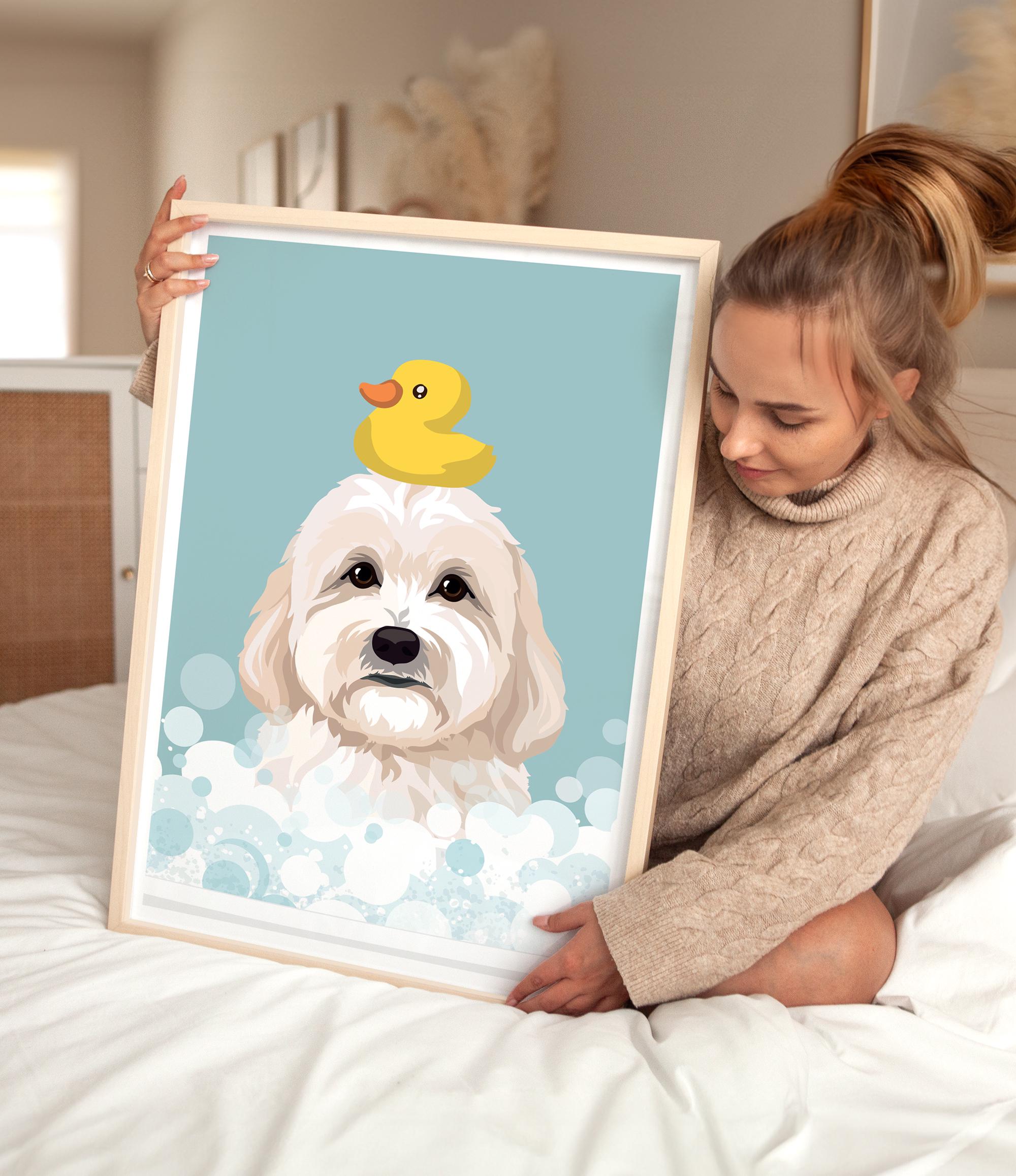 A woman is sitting on a bed holding a framed picture of a dog with a yellow rubber duck on its head.