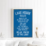 a framed sign with a list of rules for a lake house, including activities such as wakeboarding, swimming, and napping.