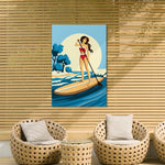 a woman paddleboarding on a beach, with a wicker chair and a wicker table in the foreground.