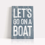 a wooden sign that says let&#39;s go on a boat