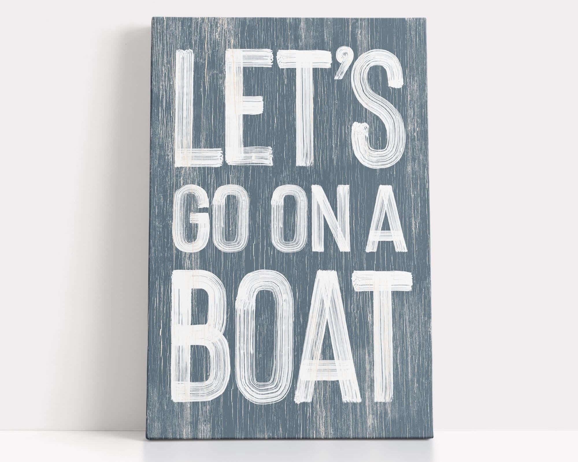 a wooden sign that says let's go on a boat