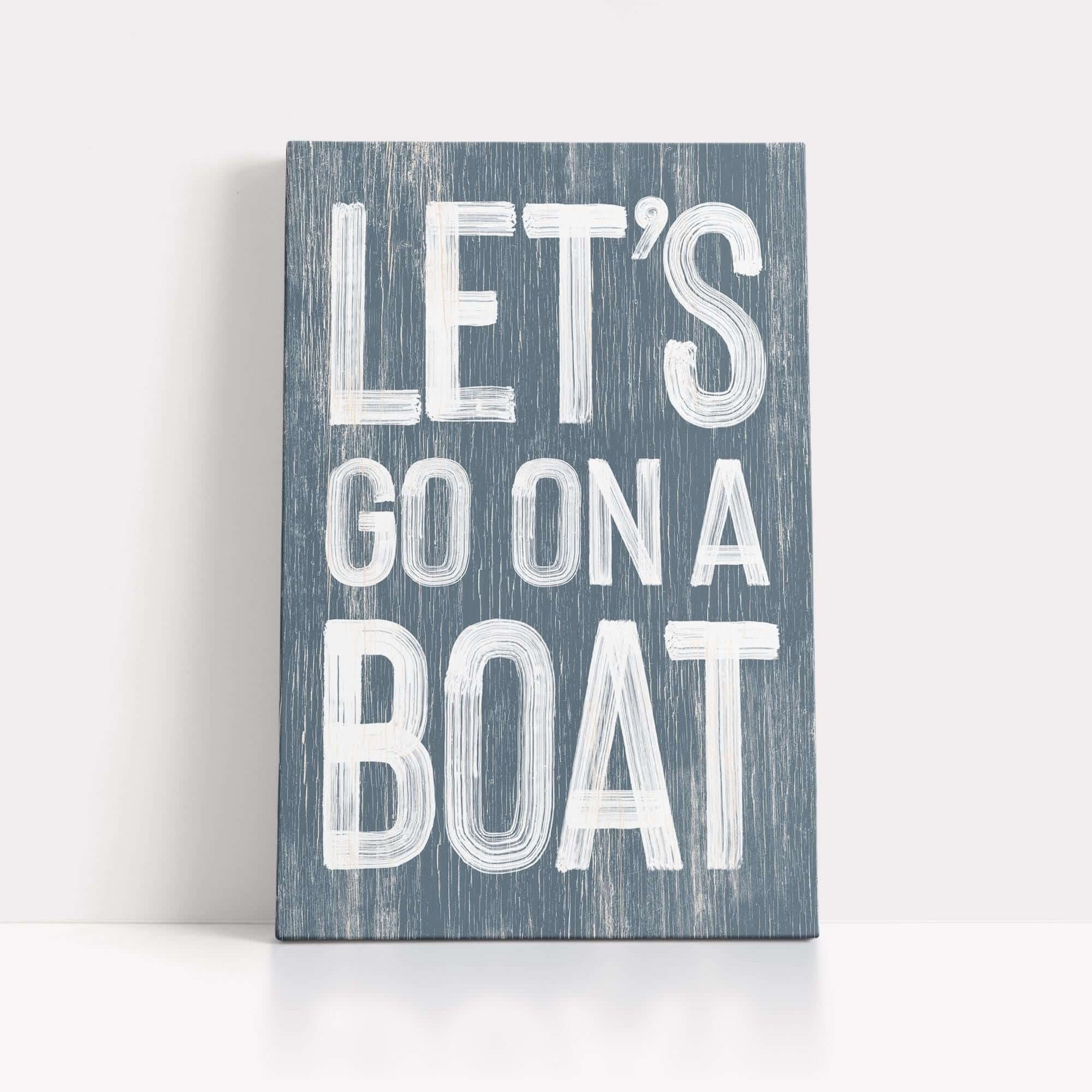 a wooden sign that says let's go on a boat