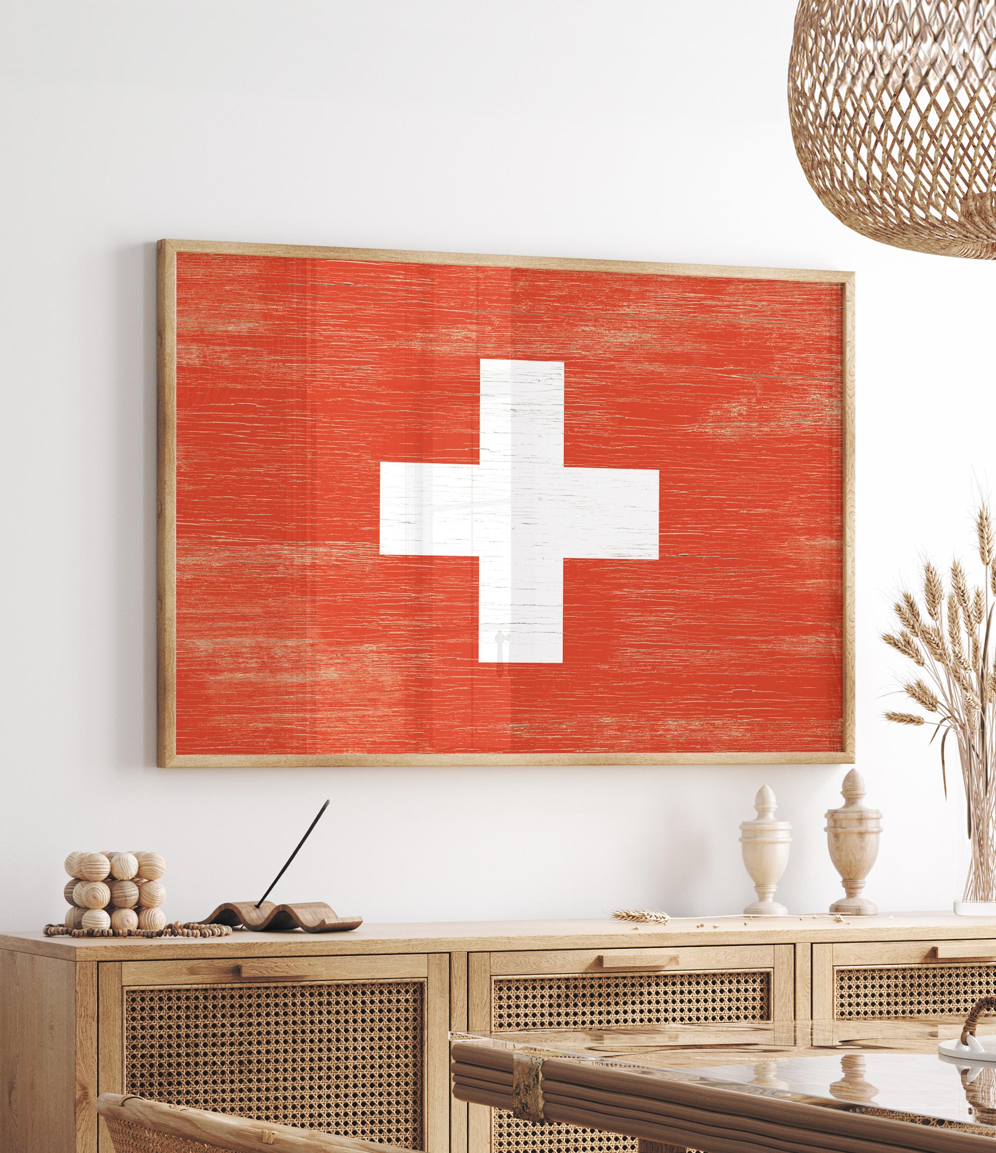 a red and white cross painted on a wall above a table