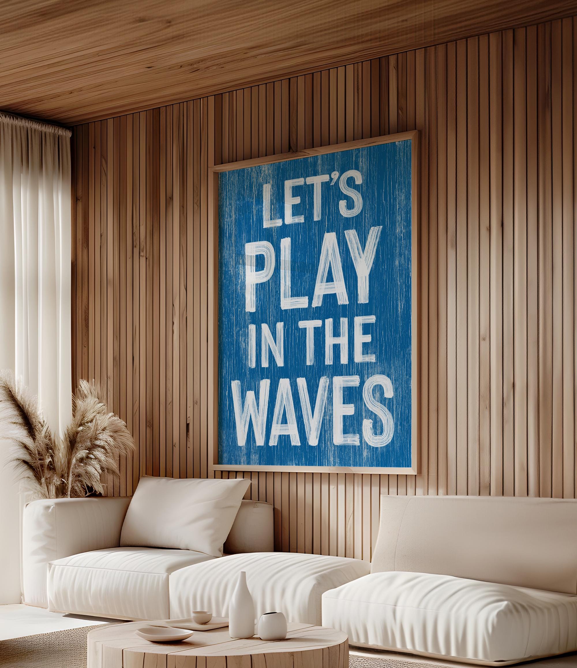 a living room with a white couch and a blue sign