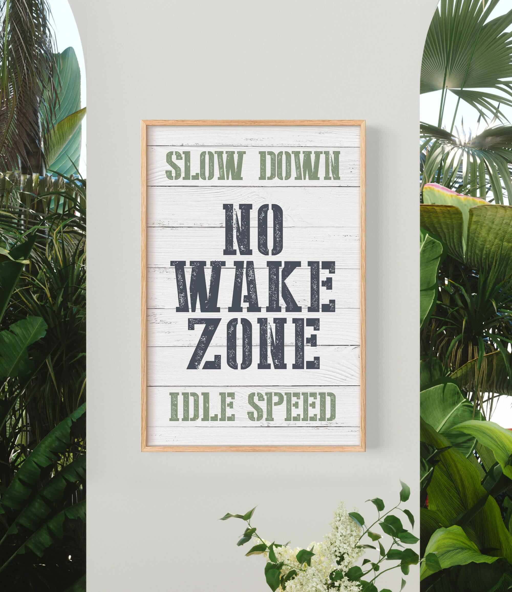 a sign that says slow down, no wake zone, idle speed
