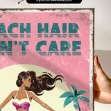 The image is a vibrant, retro-style poster with a woman in a swimsuit and palm tree, set against a pink background.