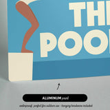The image is an aluminum print featuring a swimming pool with a woman in a white swimsuit.