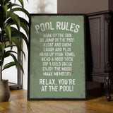 a picture of a pool rules sign next to a potted plant