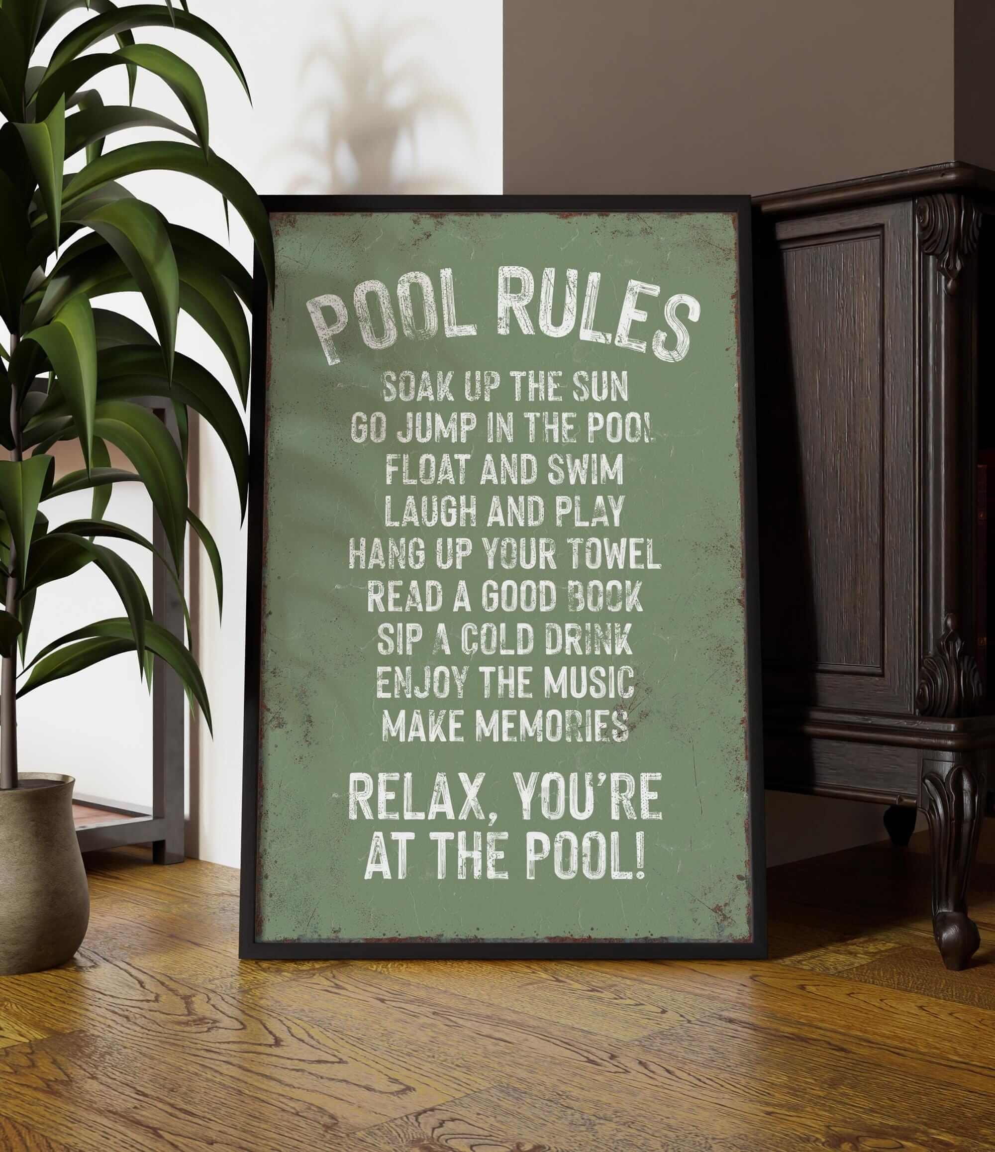 a picture of a pool rules sign next to a potted plant
