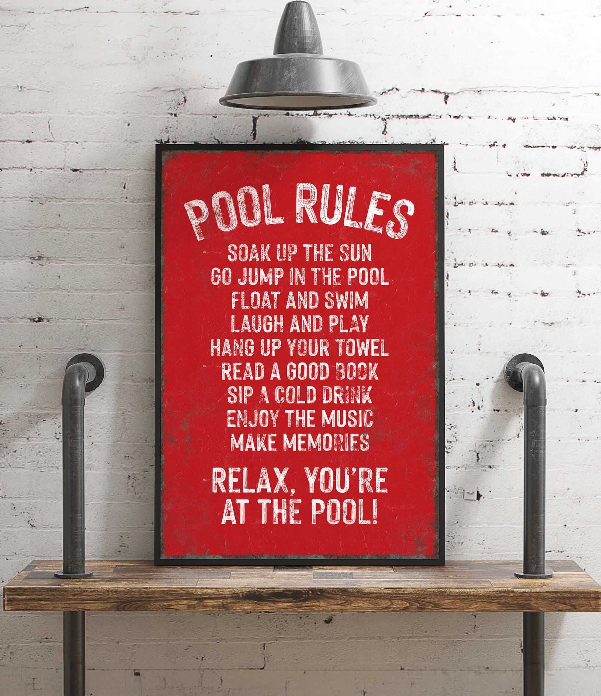 a red poster on a white brick wall