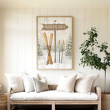 a cozy living room with a large framed picture of skis hanging on the wall above a white sofa with pillows.