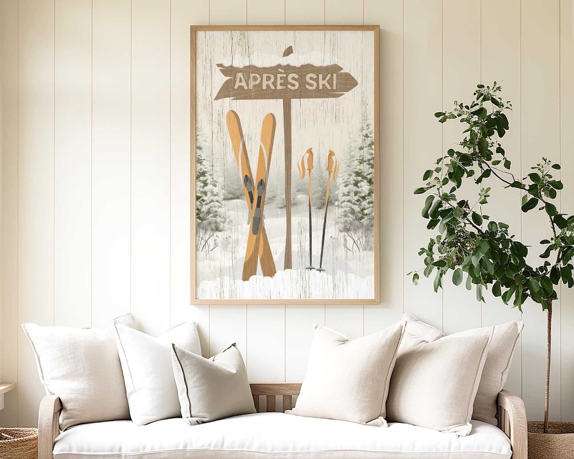 a cozy living room with a large framed picture of skis hanging on the wall above a white sofa with pillows.