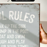 a hand holding a sign that says oil rules