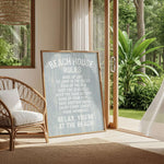 a beach house with a sign that reads "Beach House Rules" in a cozy living room setting.