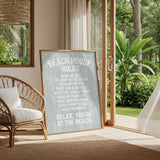 a beach house with a sign that reads "Beach House Rules" in a cozy living room setting.