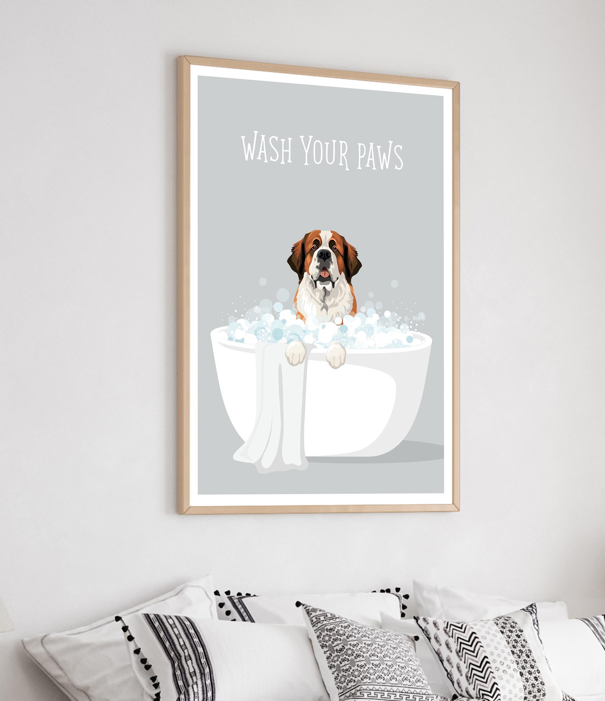 a framed poster with a cartoon illustration of a dog sitting in a bathtub filled with bubbles, with the text "WASH YOUR PAWS" written above it.