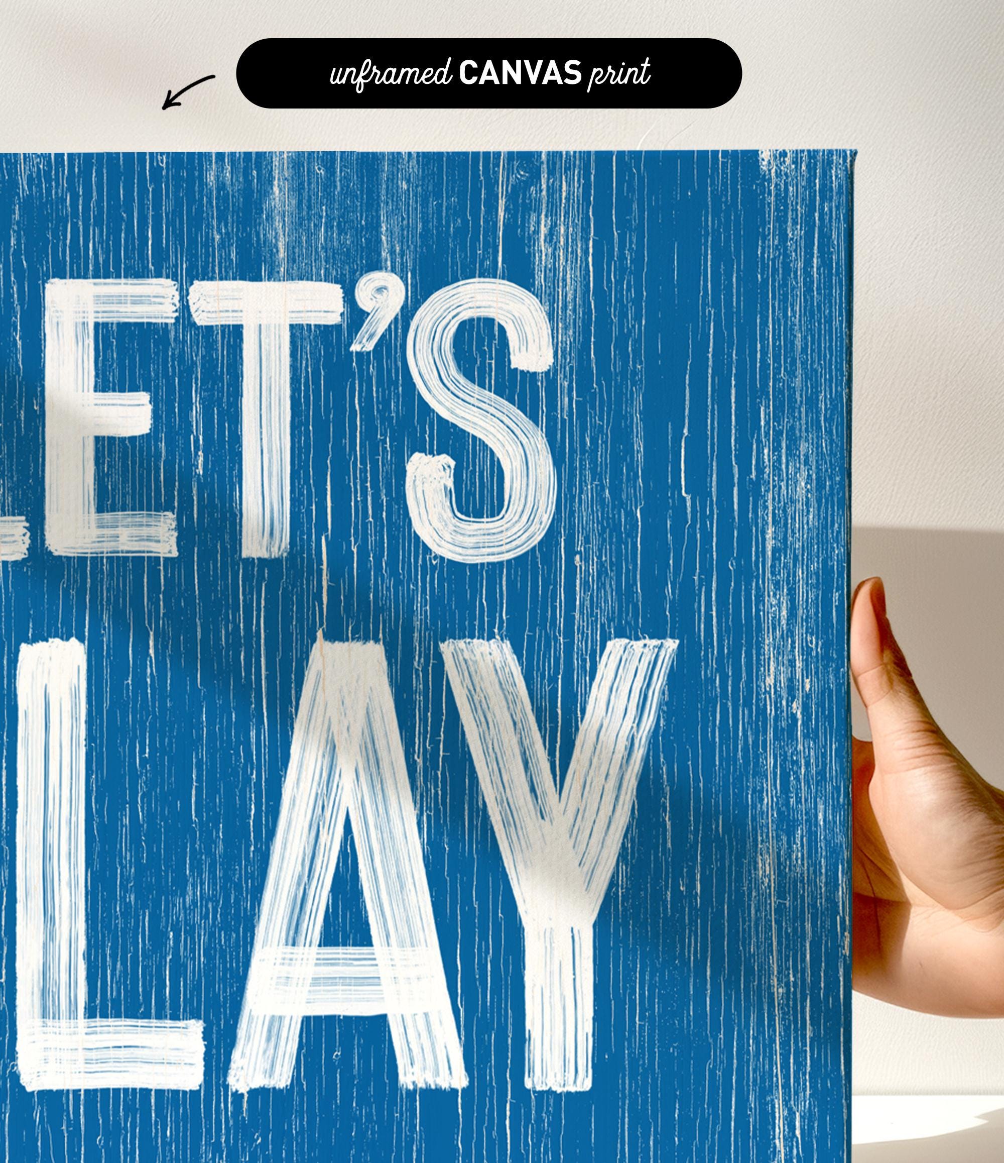 a hand holding a sign that says let&#39;s play