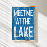 a blue sign that says meet me at the lake