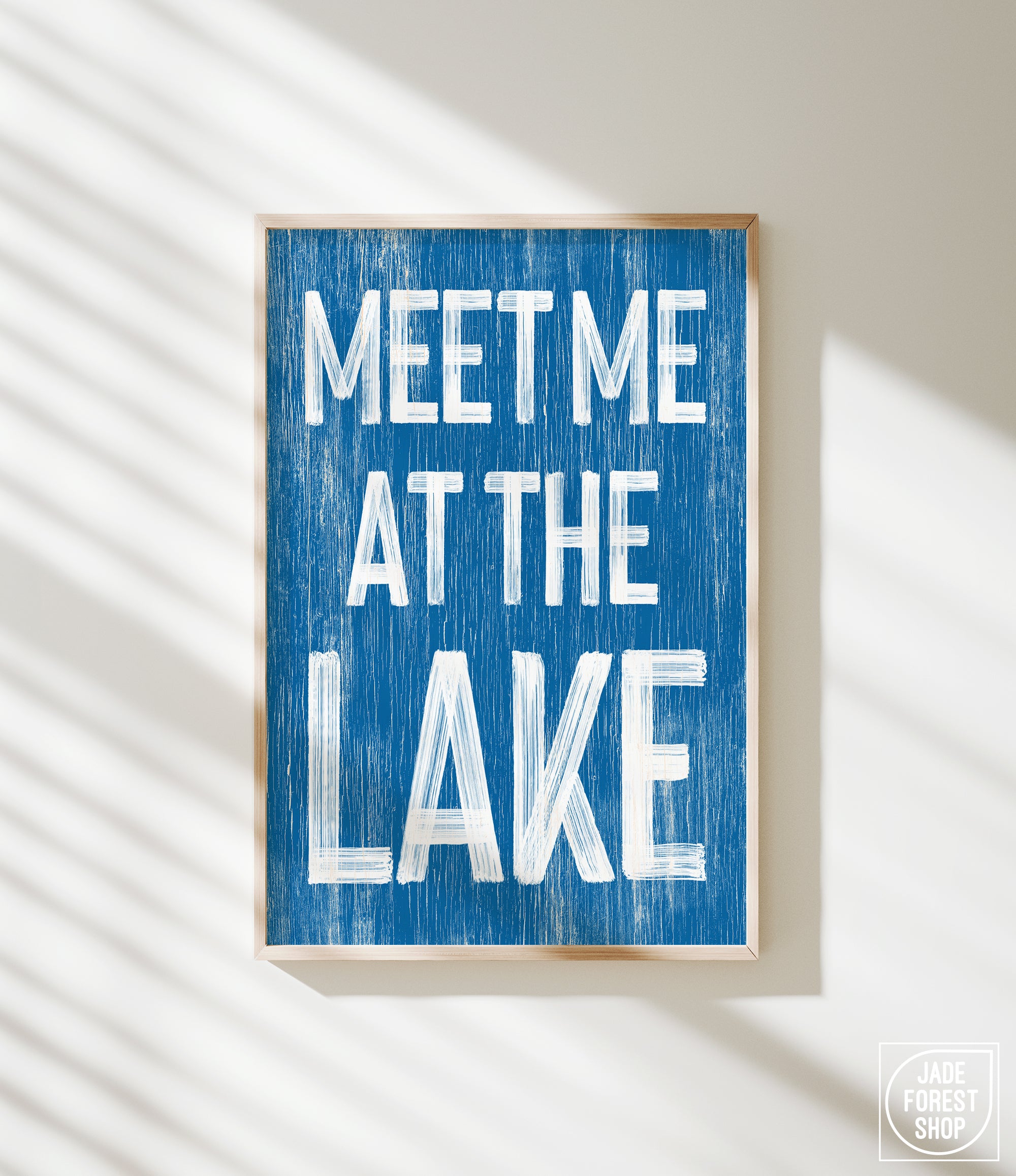 a blue sign that says meet me at the lake