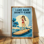 a woman paddleboarding on a lake, with the text "LAKESHORE DON'T CARE" displayed prominently.