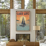 a living room with a large window and a poster on the wall