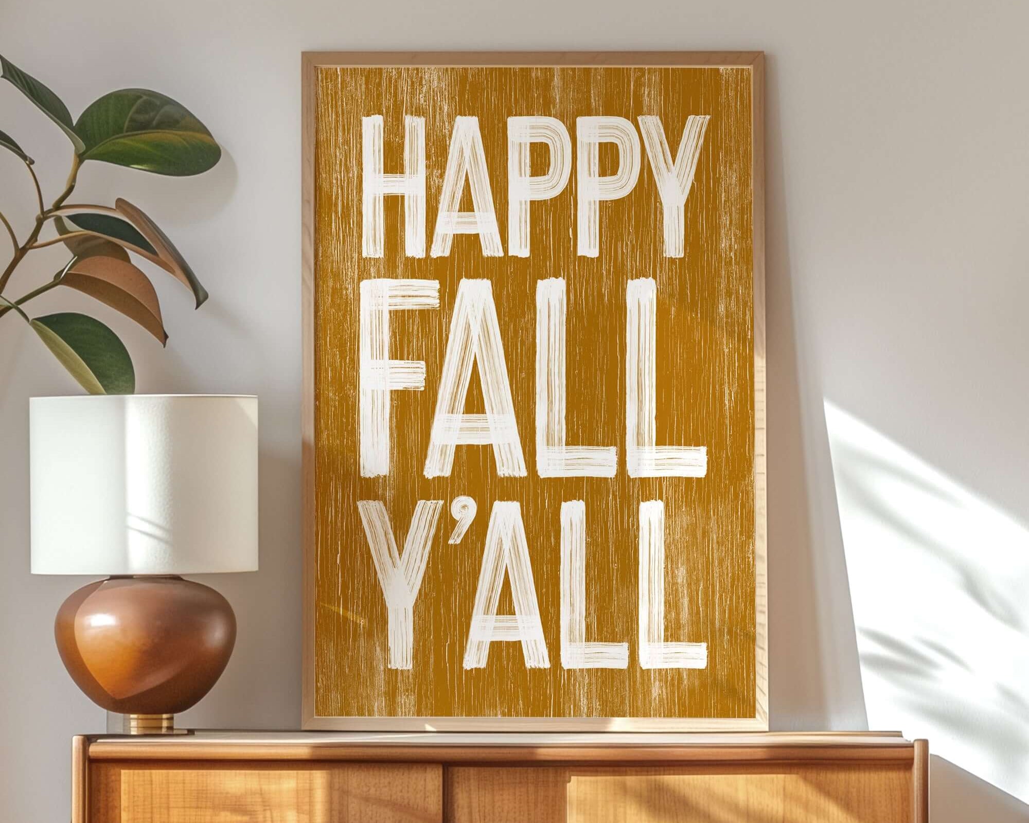 a wooden sign that says happy fall y'all