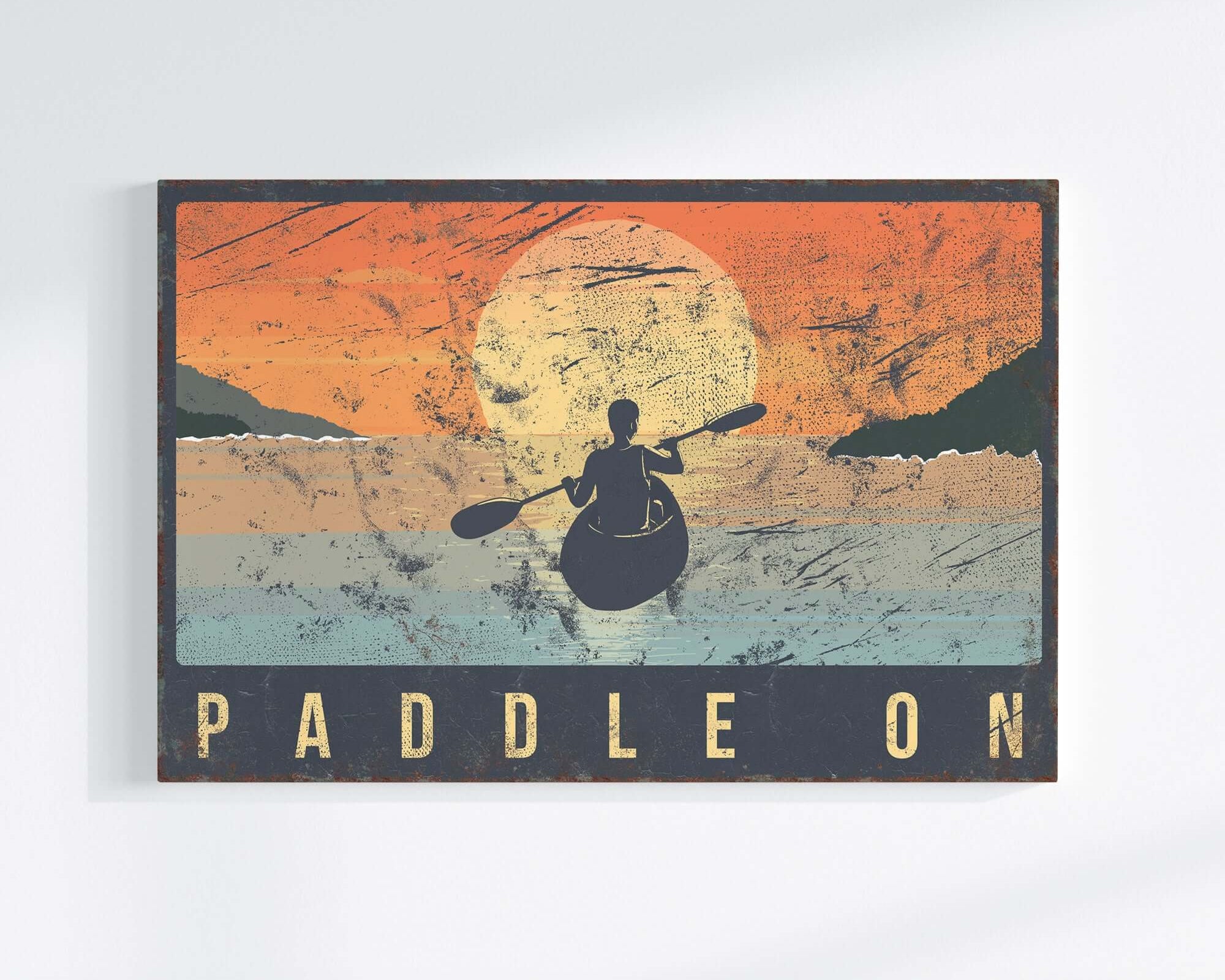 a picture of a man paddling on a canoe
