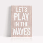a wooden sign that says let&#39;s play in the waves