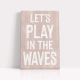 a wooden sign that says let&#39;s play in the waves