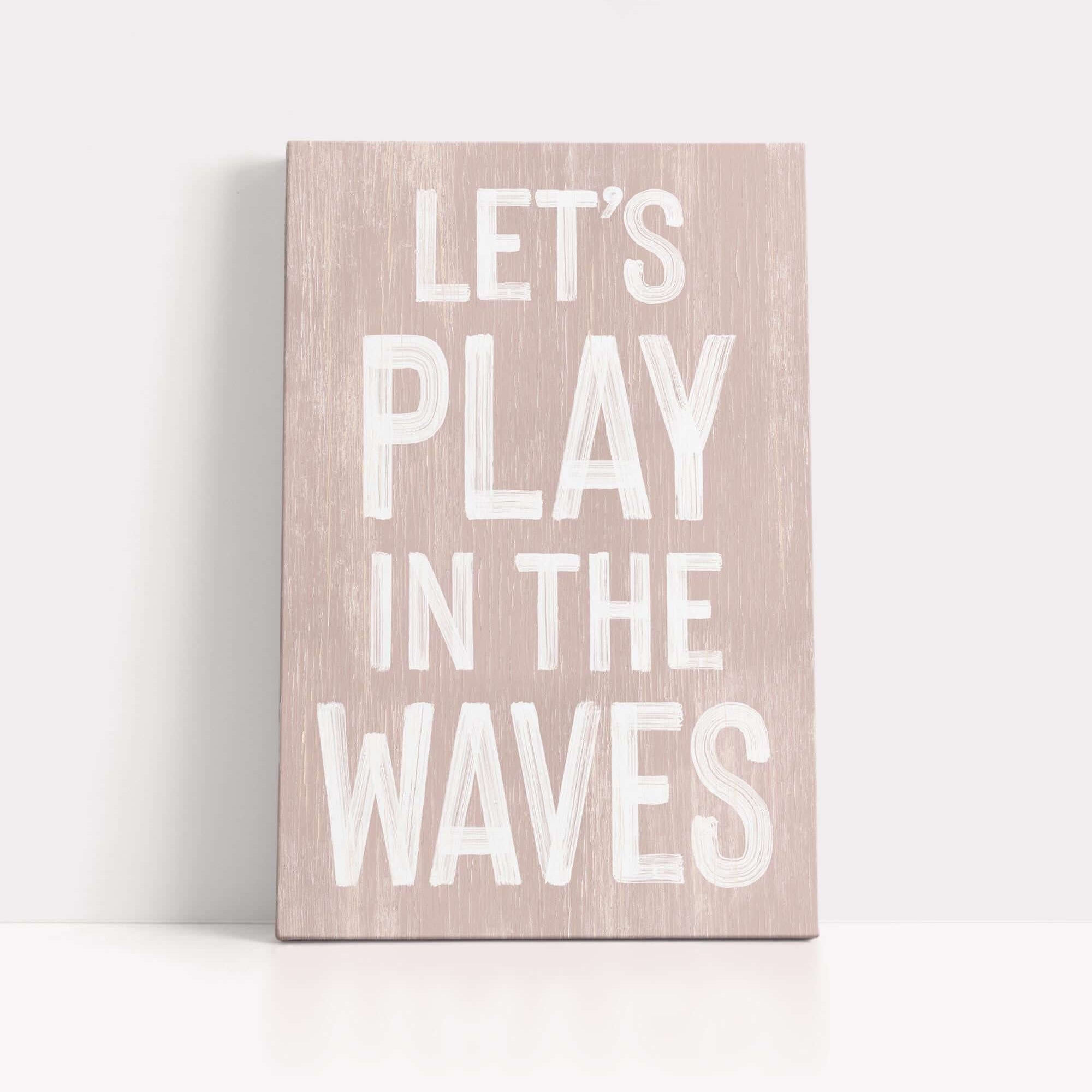 a wooden sign that says let's play in the waves
