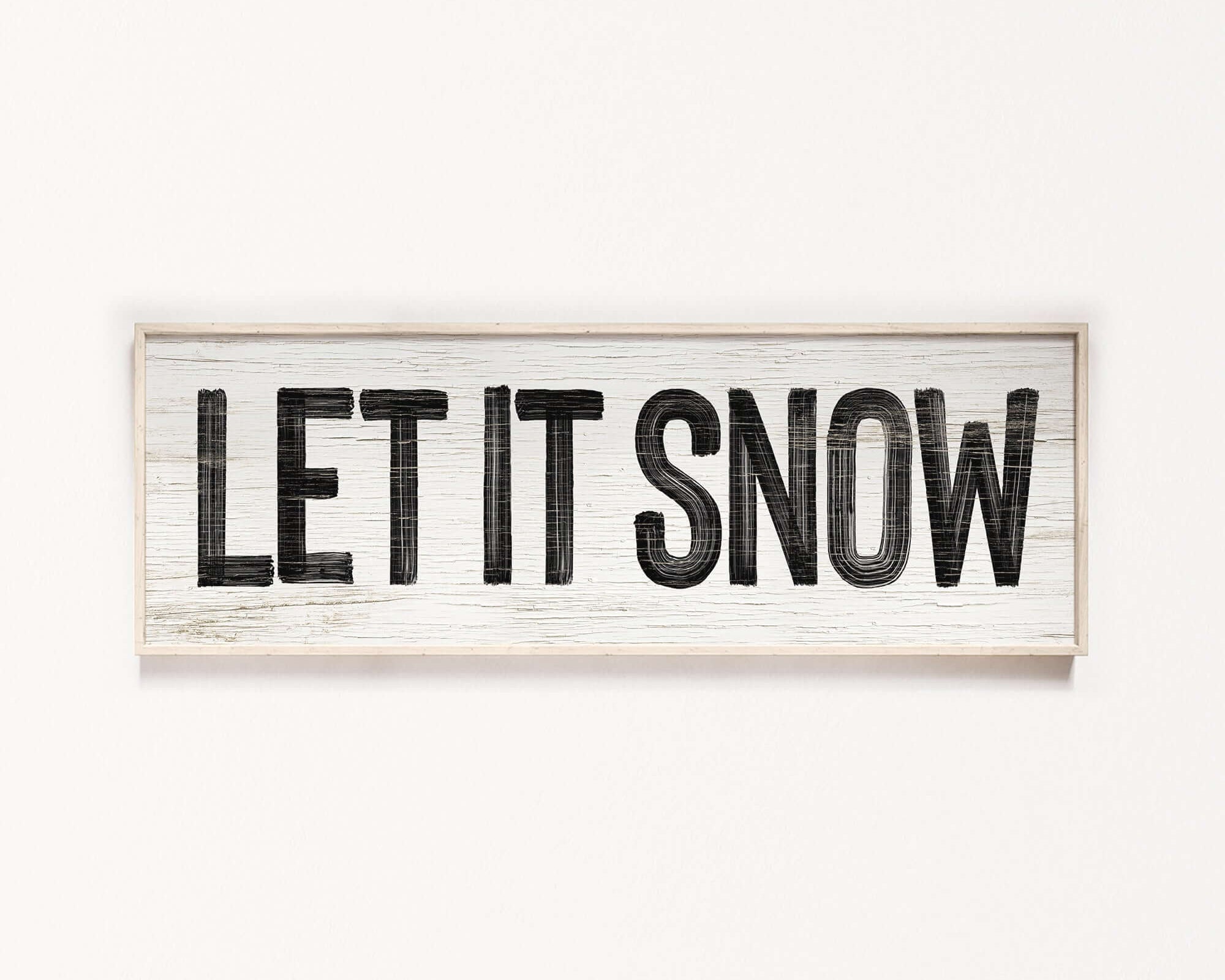 a wooden sign that says let it snow