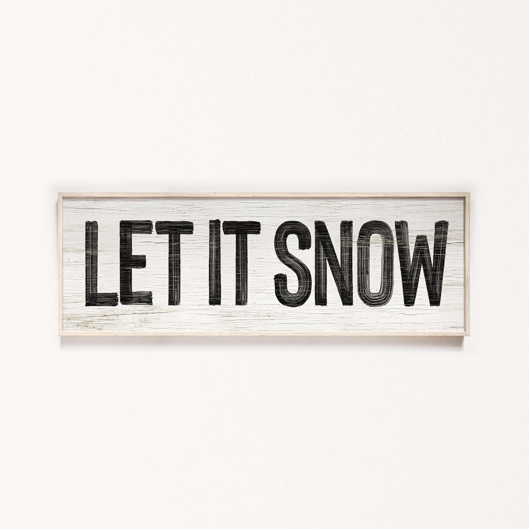 a wooden sign that says let it snow