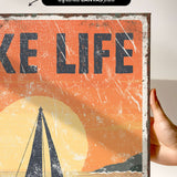 a person holding up a poster with a boat on it