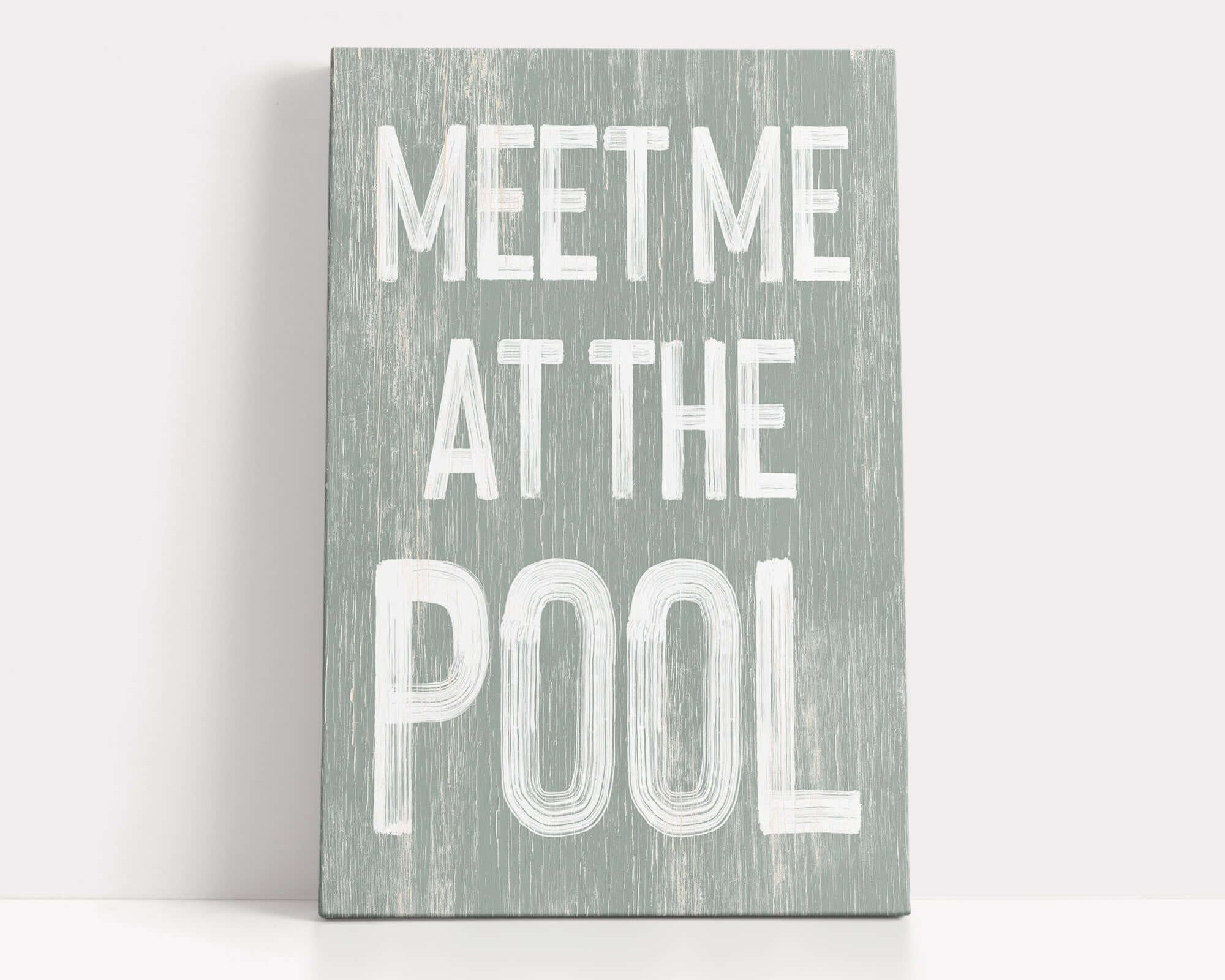 a wooden sign that says meet me at the pool
