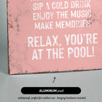 a pink sign that says relax you&#39;re at the pool