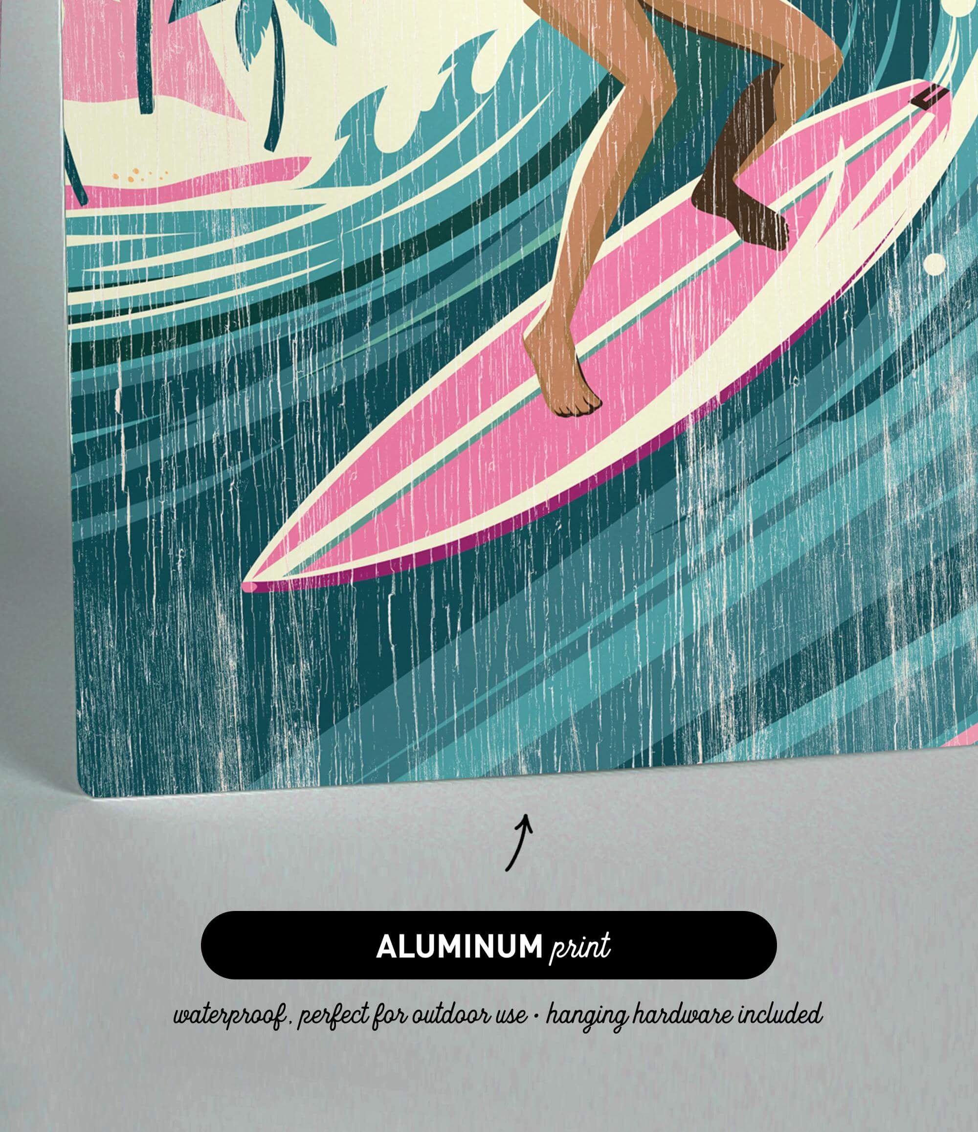 The image is an aluminum print featuring a woman surfing on a pink surfboard.