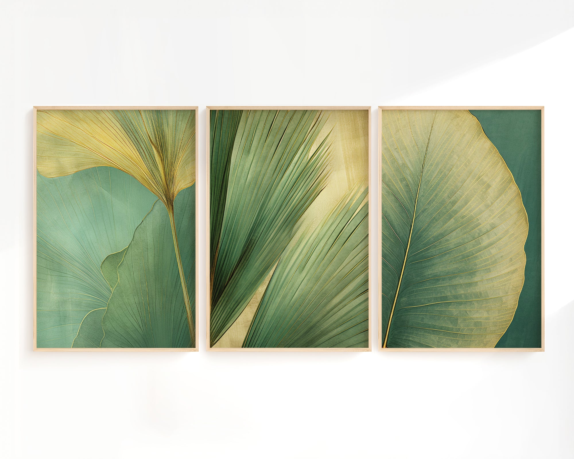 three framed artworks depicting various green leaf patterns, arranged in a row on a white wall.