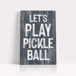 a wooden sign that says let's play pickle ball