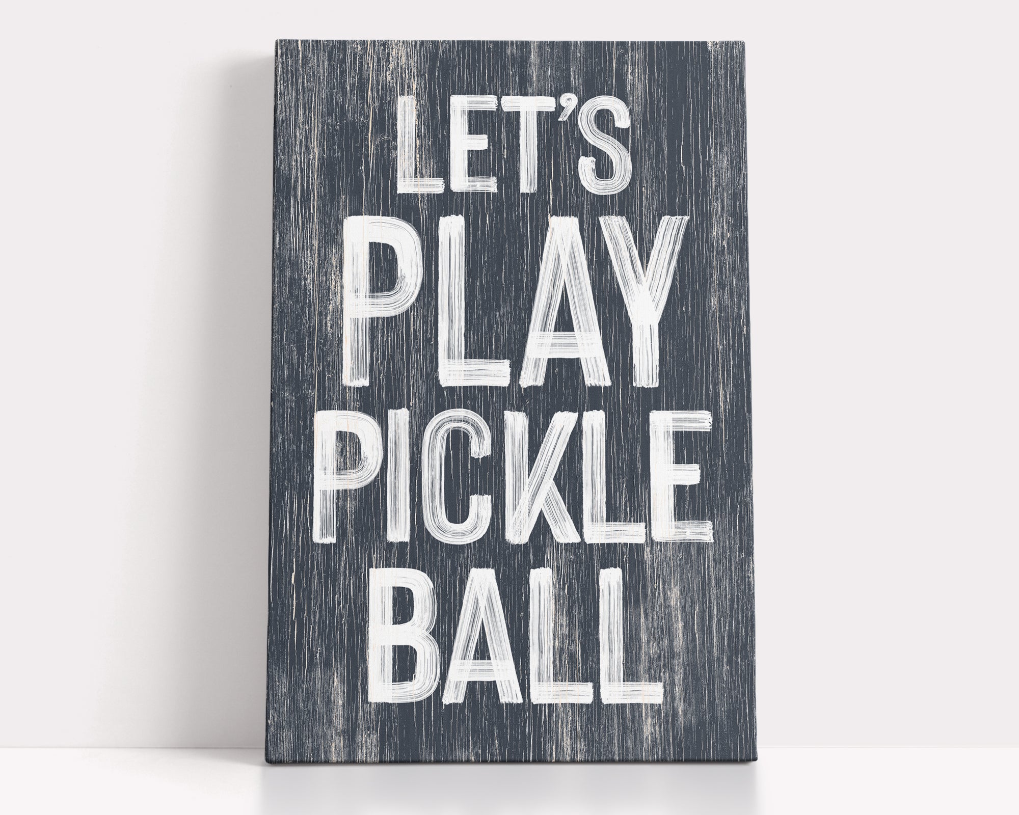 a wooden sign that says let's play pickle ball