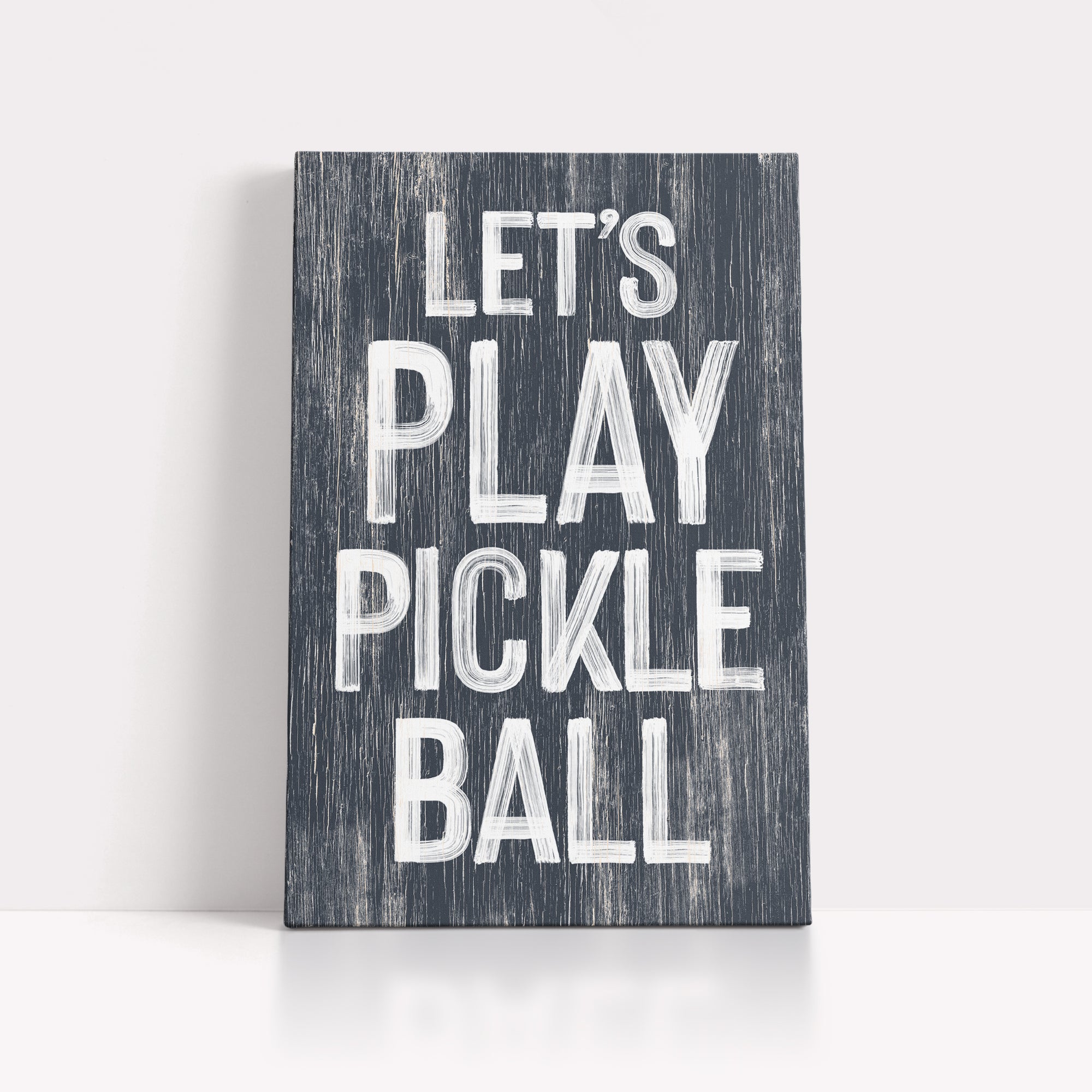 a wooden sign that says let's play pickle ball