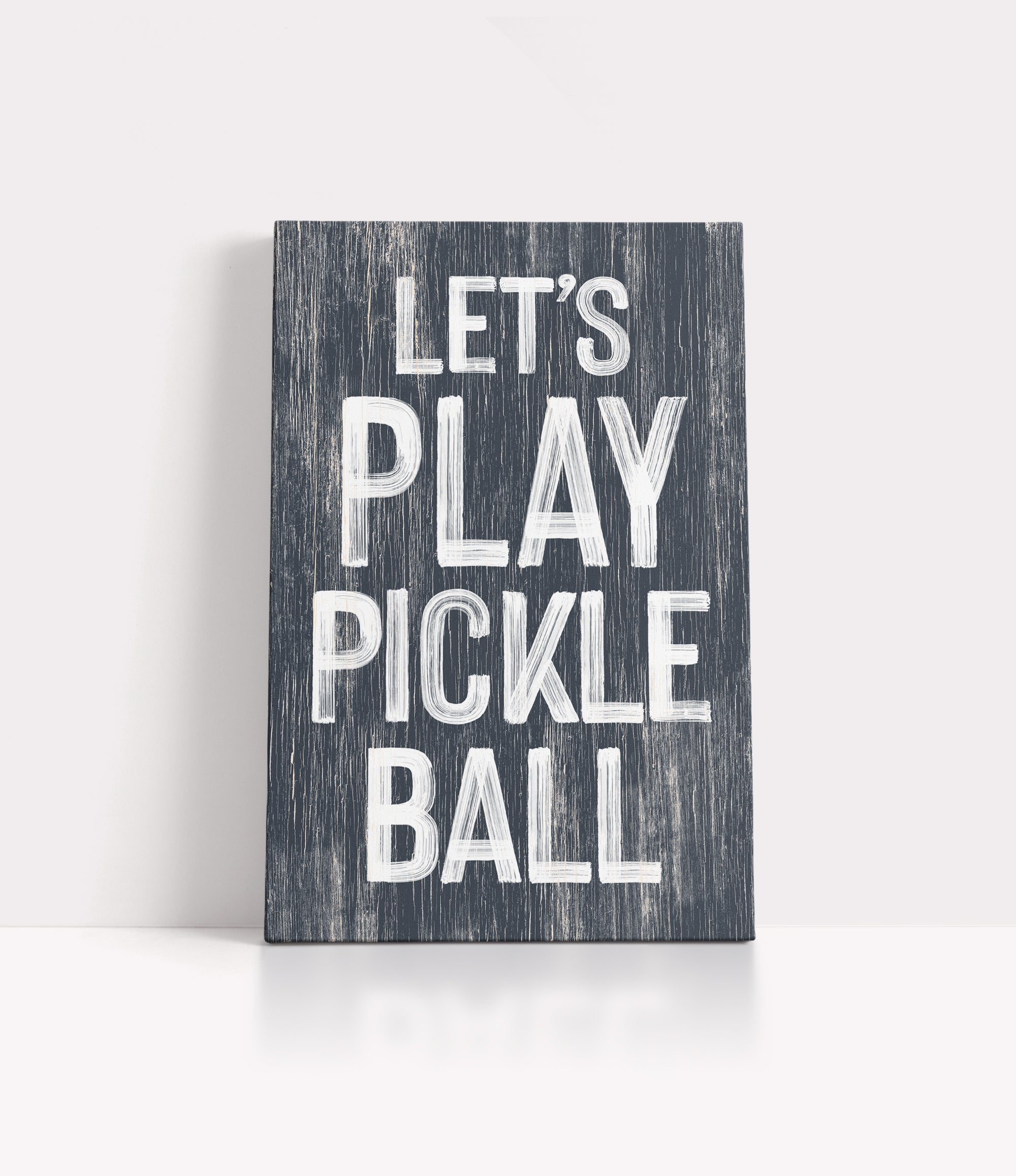 a wooden sign that says let's play pickle ball