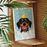 A framed illustration of a dog with a yellow rubber duck on its head, surrounded by bubbles, is displayed on a woven shelf.